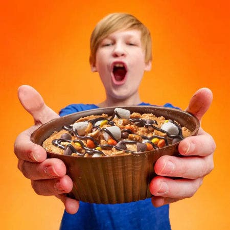 boy holding custom reeses cup