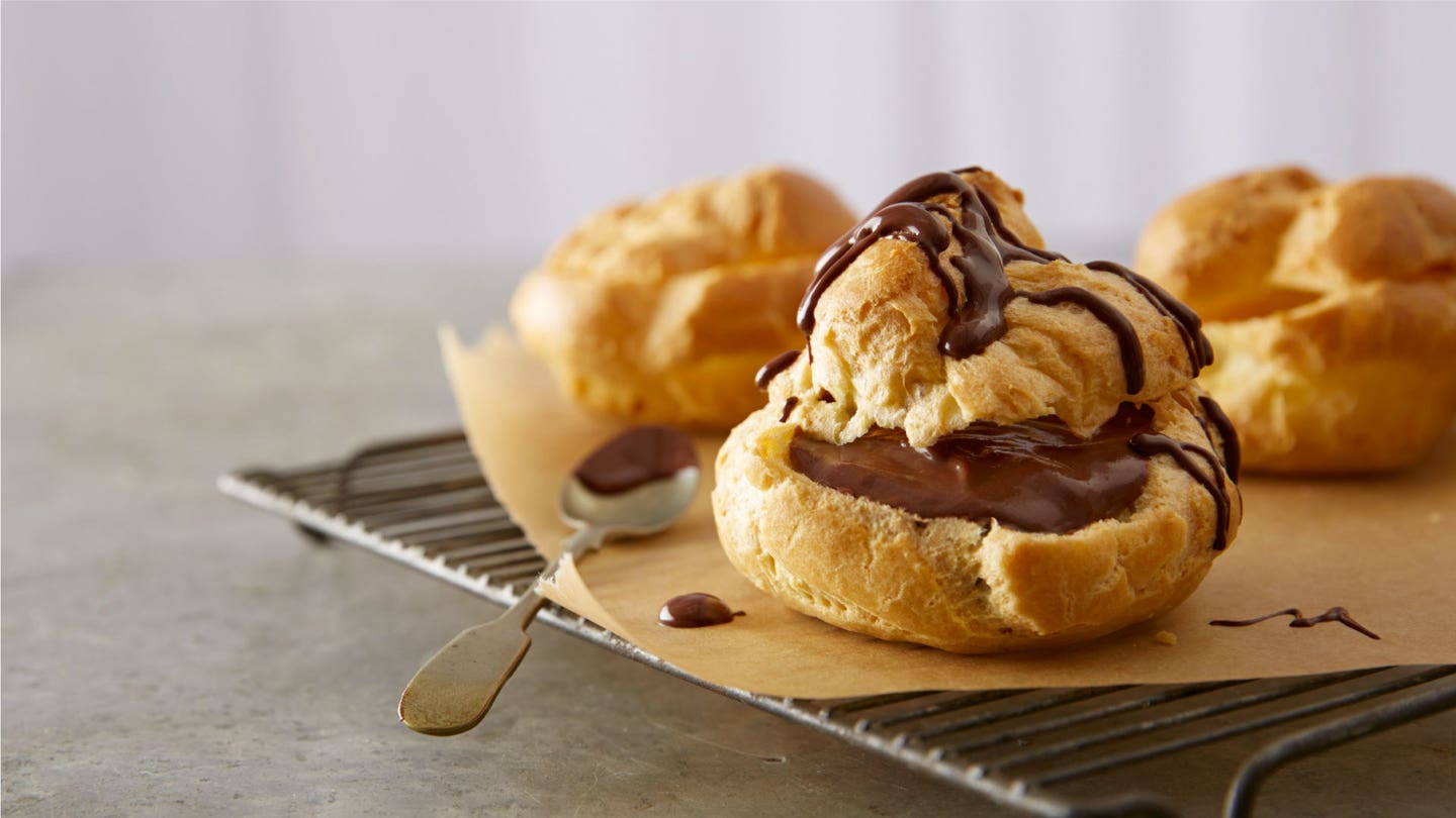 rich chocolate glazed cream puffs