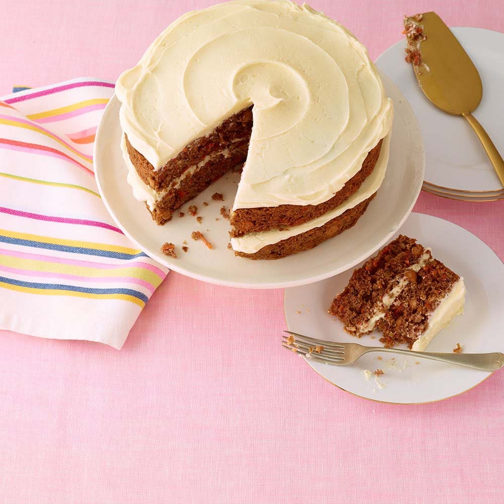 slicing and serving a freshly made carrot cake