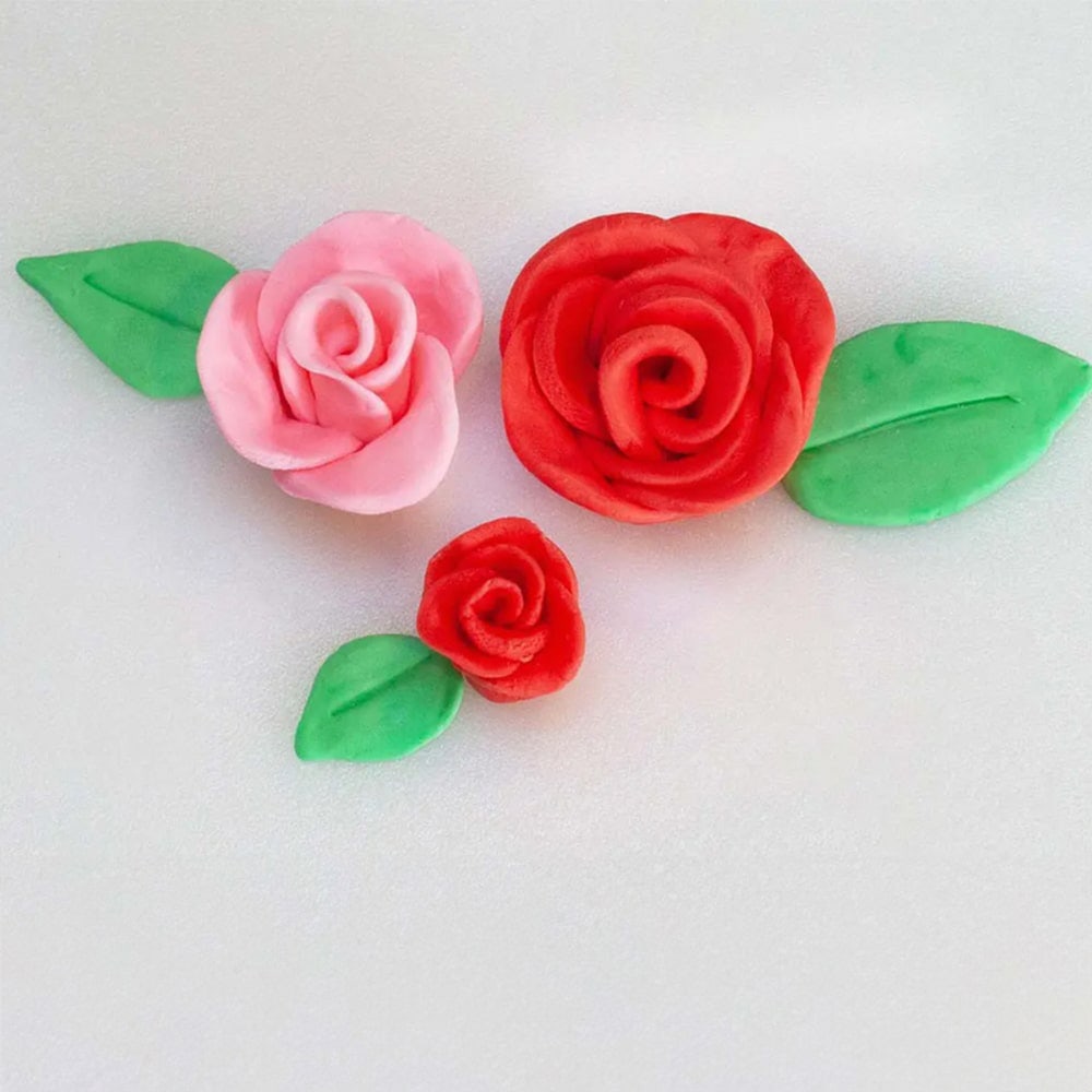 set of red and pink roses made out of fondant