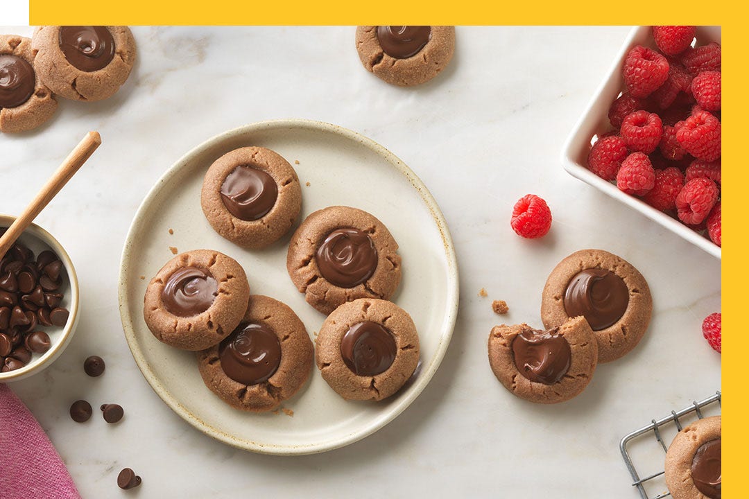 plate of cookies with melted hersheys kisses in the center