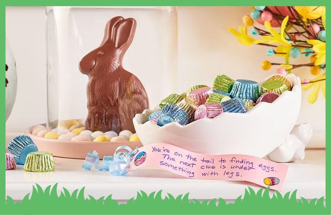 hershey easter chocolate candies in decorative bowls next to a clue from a scavenger hunt