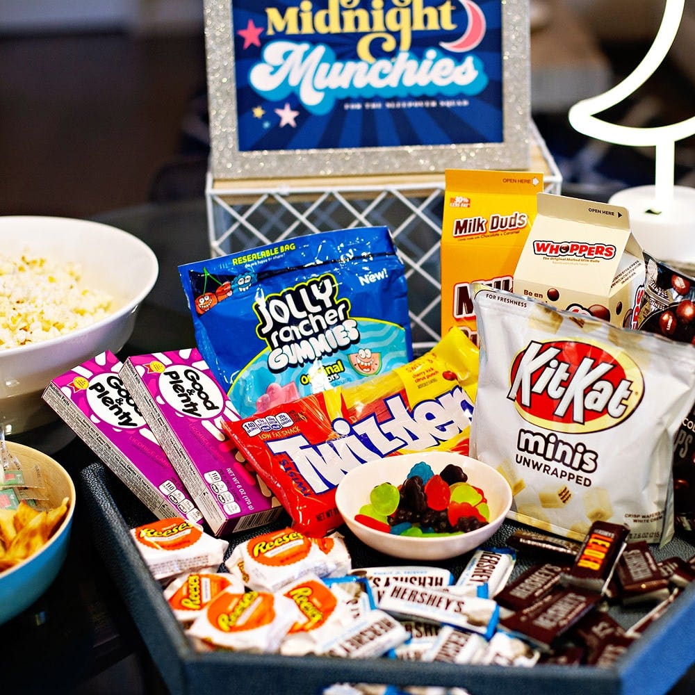 large snack tray filled with assorted hersheys candy