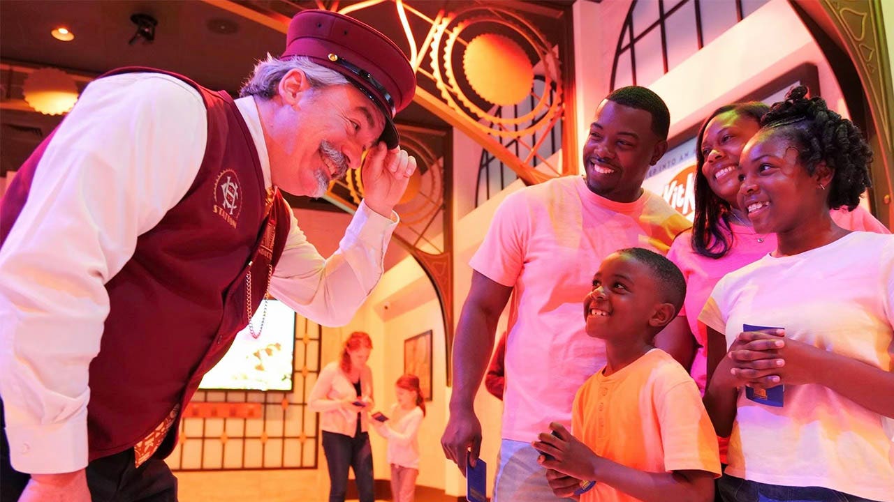 hersheyland express conductor with chocolate world guests