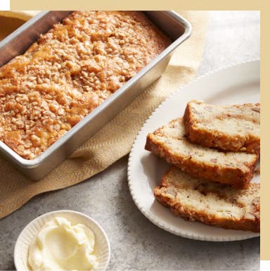 loaf of banana bread and slices on a plate