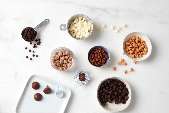 bowls filled with different flavors of hersheys baking chips