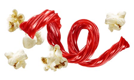 twizzlers strawberry twist surrounded by pieces of skinnypop popcorn