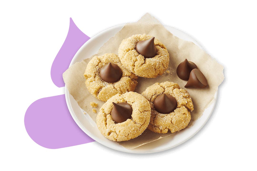 plate of freshly made hersheys peanut butter blossoms