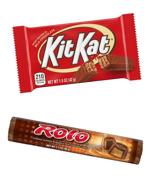 kit kat milk chocolate candy bar beside rolo creamy caramels in rich chocolate candy